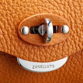 ORANGE SPUMA HAMMERED LEATHER SMALL LETTER CLUTCH BAG | Zanellato